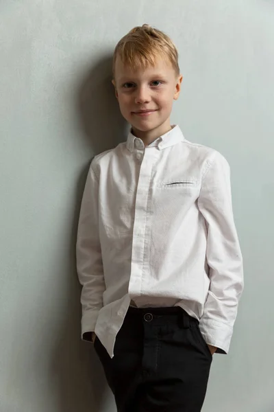 Smiling Boy Stands Wall Casually Dressed Child White Shirt Dark — Stockfoto