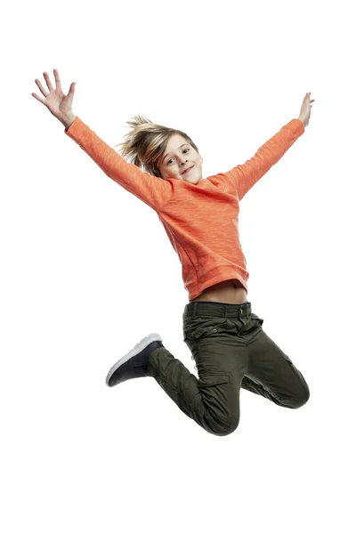 Oyful Boy Jumping Child Fashionable Hairstyle Dark Jeans Orange Sweater Stock Photo