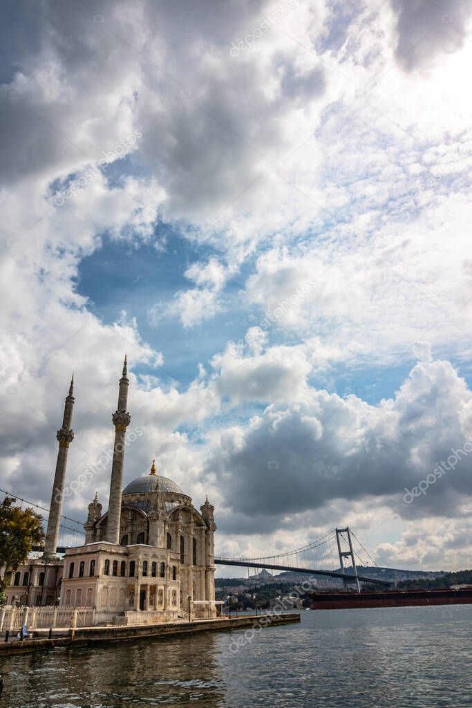 Ortakoy Mosque. Ortakoy Mosque and Bosphorus Bridge with cloudy sky in Istanbul. Ramadan or kandil or islamic background photo.
