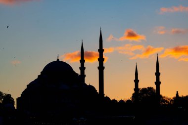 Mosque background photo. Silhouette of Suleymaniye Mosque at sunset. Ramadan or kandil or iftar or laylat al-qadr or islamic background photo. Noise effect included.
