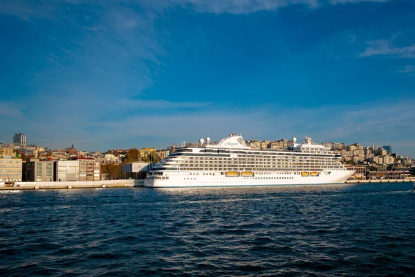 Cruise ship in Istanbul. A cruise ship in Galataport from a ferry. Tourism in Turkey background photo. Istanbul Turkey - 11.13.2021