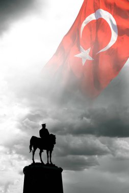 Silhouette of the monument of Ataturk and Turkish Flag on the sky in vertical view. Turkish national or public holidays. 10th november or 10 kasim background photo.