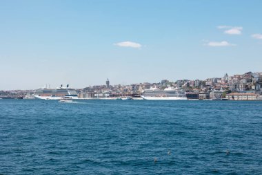 Tourism in Istanbul. Cruise ships and Galataport with Galata Tower. Istanbul Turkey - 5.7.2022