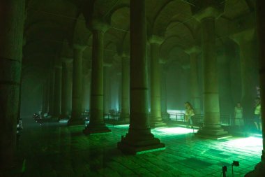 Interior of Basilica Cistern or Yerebatan Sarnici with green lights. Travel to Istanbul background photo. Istanbul Turkey - 8.3.2022