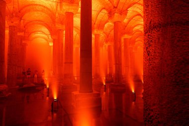Travel to Istanbul. The Basilica Cistern or Yerebatan Sarnici with red ambient lights. Noise and grain included. Selective focus. Istanbul Turkey - 8.3.2022