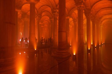 The Basilica Cistern with orange light ambient. Tourism in Istanbul background photo. Noise and grain included. Selective focus. Istanbul Turkey - 8.3.2022