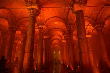 Basilica Cistern with red ambient light. Travel to Istanbul background photo. Noise and grain included. Selective focus. Istanbul Turkey - 8.3.2022