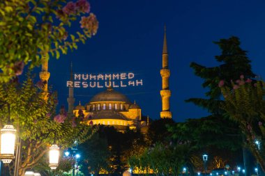 Islamic background photo. Sultanahmet or Blue Mosque in Istanbul. Mohammad the messenger of God or Allah text between the minarets. Selective focus.