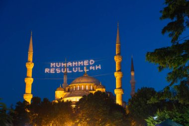Islamic background. Sultanahmet aka Blue Mosque in Istanbul at night. Ramadan or kandil or laylat al-qadr or kadir gecesi background photo. Mohammad the messenger of God text on photo.