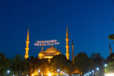 Islamic photo. Sultanahmet or Blue Mosque in Istanbul at night. Ramadan or kandil or laylat al-qadr or kadir gecesi background. Mohammad the messenger of God text on photo. Noise or grain included.