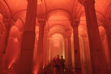 People visiting the Basilica Cistern in Istanbul. Travel to Turkey concept photo. Noise and grain included. Selective focus. Istanbul Turkey - 8.3.2022