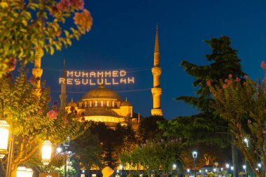 Islamic background. Sultanahmet or Blue Mosque at night in Istanbul. Ramadan or kandil or laylat al-qadr background photo. Mohammad the messenger of God text on photo.