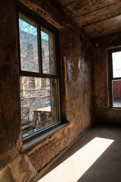 Abandoned building. An abandoned building illuminated by sun at daytime. Historical empty buildings.