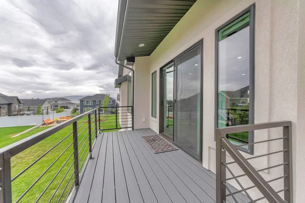 House deck of a house with sliding glass and screen door