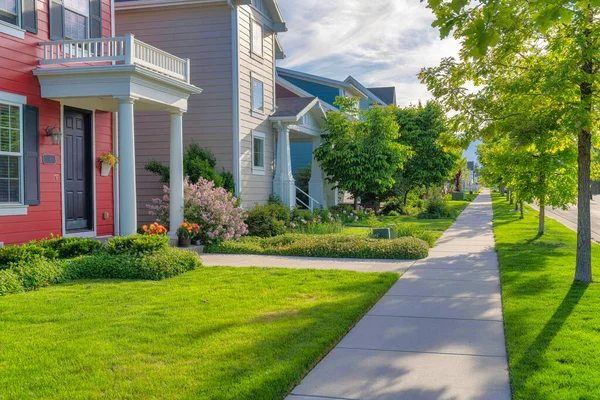 Concrete pavement of a sidewalk in front of the residential houses in Daybreak, Utah