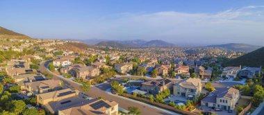 Entire view of a residential area from Double Peak Park in San Marcos, California. Suburban community near the mountains against the sky background. clipart