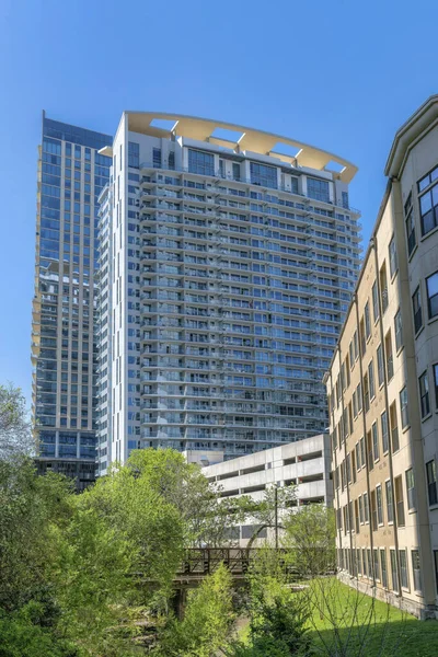 Apartment complex in Austin Texas with blue sky background on a sunny day. Exterior view of modern housing units and residential buildings in the city with modern architecture.