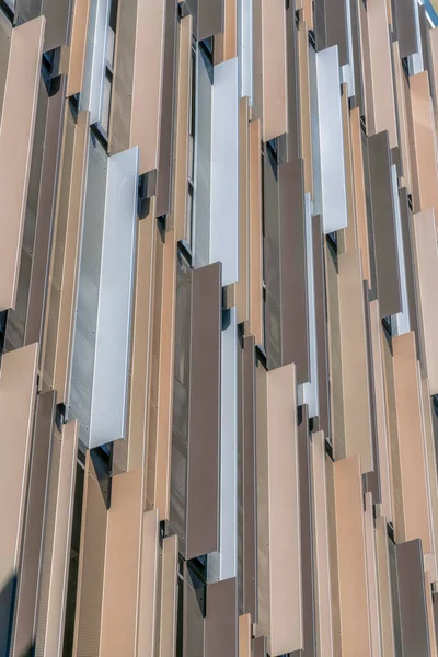 Geometric pattern design on the exterior wall of a building in Austin Texas. Close up view of an apartment or office facade with modern geometrical architecture style.