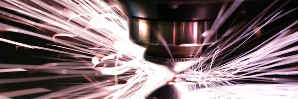 Laser cut machine industrial metal processing process closeup background