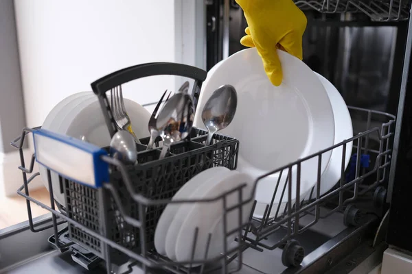 Complete dishwasher with clean washed dishes closeup — Stock Photo, Image