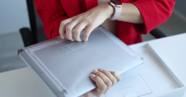 Minsk, Belarus, October 20, 2021: Woman unboxing new Apple Macbook Air 4k movie — 비디오