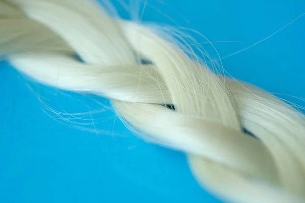 Hair is braided in faux hair braid closeup — Stock Photo, Image