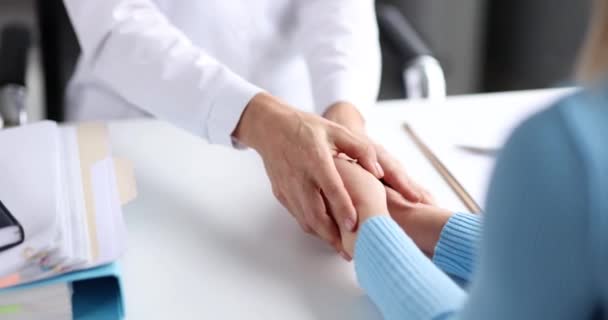 Doctor holding patient hands and soothing 4k movie slow motion — Stock Video