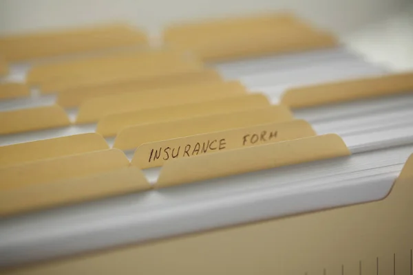 Archive of documents insurance forms in a row, close-up — Stock Photo, Image