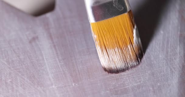 Brush painting wooden surface with silver paint closeup 4k movie slow motion — Stock Video