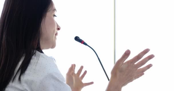 Woman speaker talking into microphone at business conference 4k movie slow motion — Stock Video