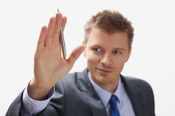 Handsome businessman wave hello holding silver pen on hand — Stockfoto