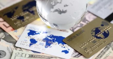 Glass globe bank notes and credit bank cards