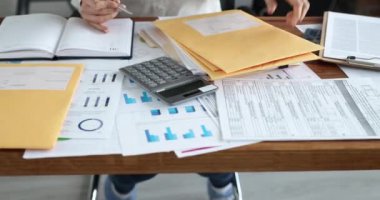 Woman secretary checks received correspondence at workplace