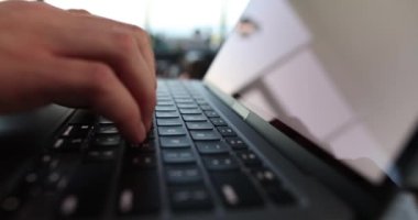 Male hands are typing on computer closeup