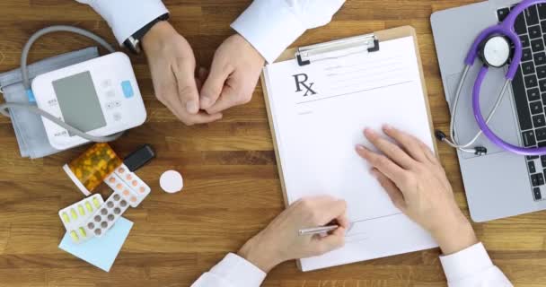 Doctor writes medical prescription for patient