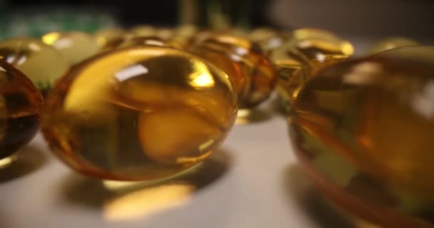 Fish oil capsules or yellow oil with Omega-3 vitamin — 图库视频影像