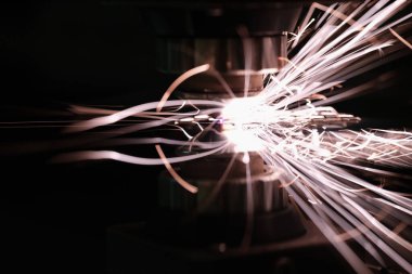 Bright sparks from metal contact on a machine tool