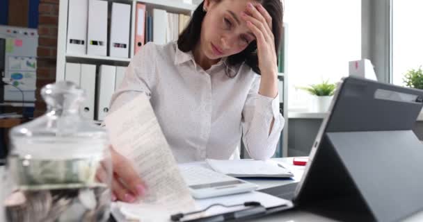 Sad depressed woman looking at financial accounts closeup — Stock Video