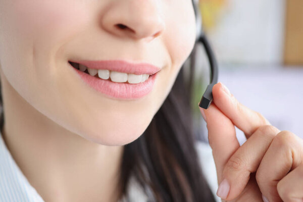 Woman mouth smile, support service worker and small microphone for voice connection