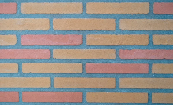 Brown tiles in form of bricks on wall background closeup — Stock Photo, Image