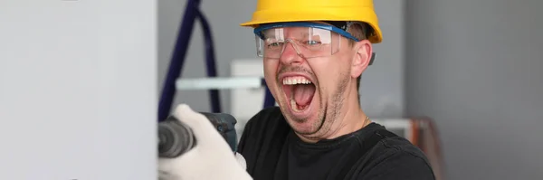 Handyman make hole with device — Stock Photo, Image