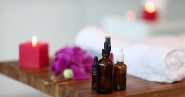 Essential oil in dark bottles in spa salon closeup
