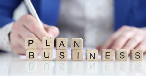 Person develops business plan for successful business closeup — Wideo stockowe