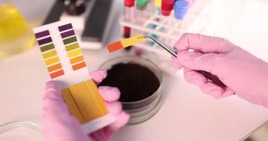 Scientist with saltpeter samples Founded to study biotechnology in laboratory