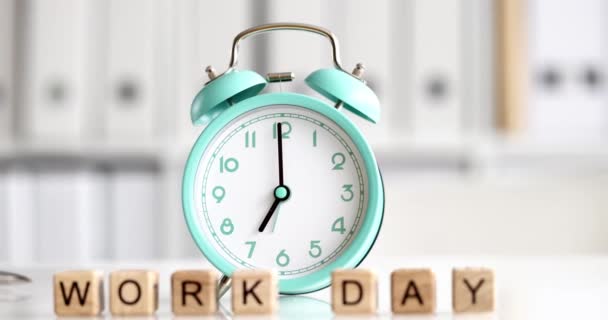 Alarm clock for seven oclock and text working day closeup — Wideo stockowe