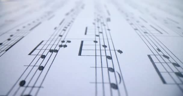楽譜の白い音符の音楽概念的背景マクロビュー — ストック動画
