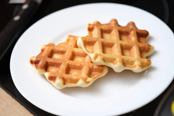 Delicious belgian waffles on white plate, yummy breakfast — Foto de Stock