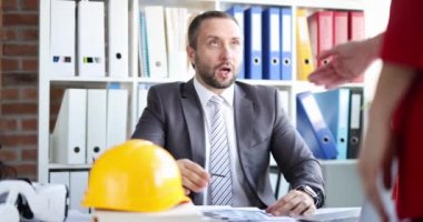 Builder and contractor shaking hands while meeting house renovation project and investment financing