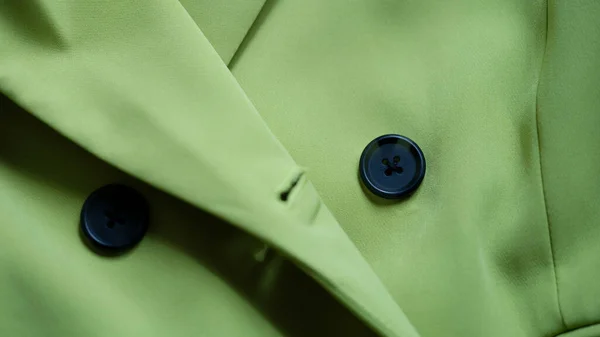 Green stylish suit with black buttons closeup —  Fotos de Stock