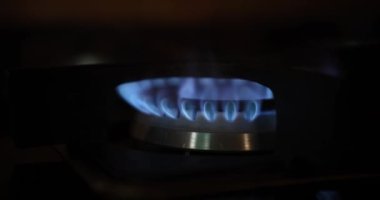 Cooking gas stove and electric stove on dark background